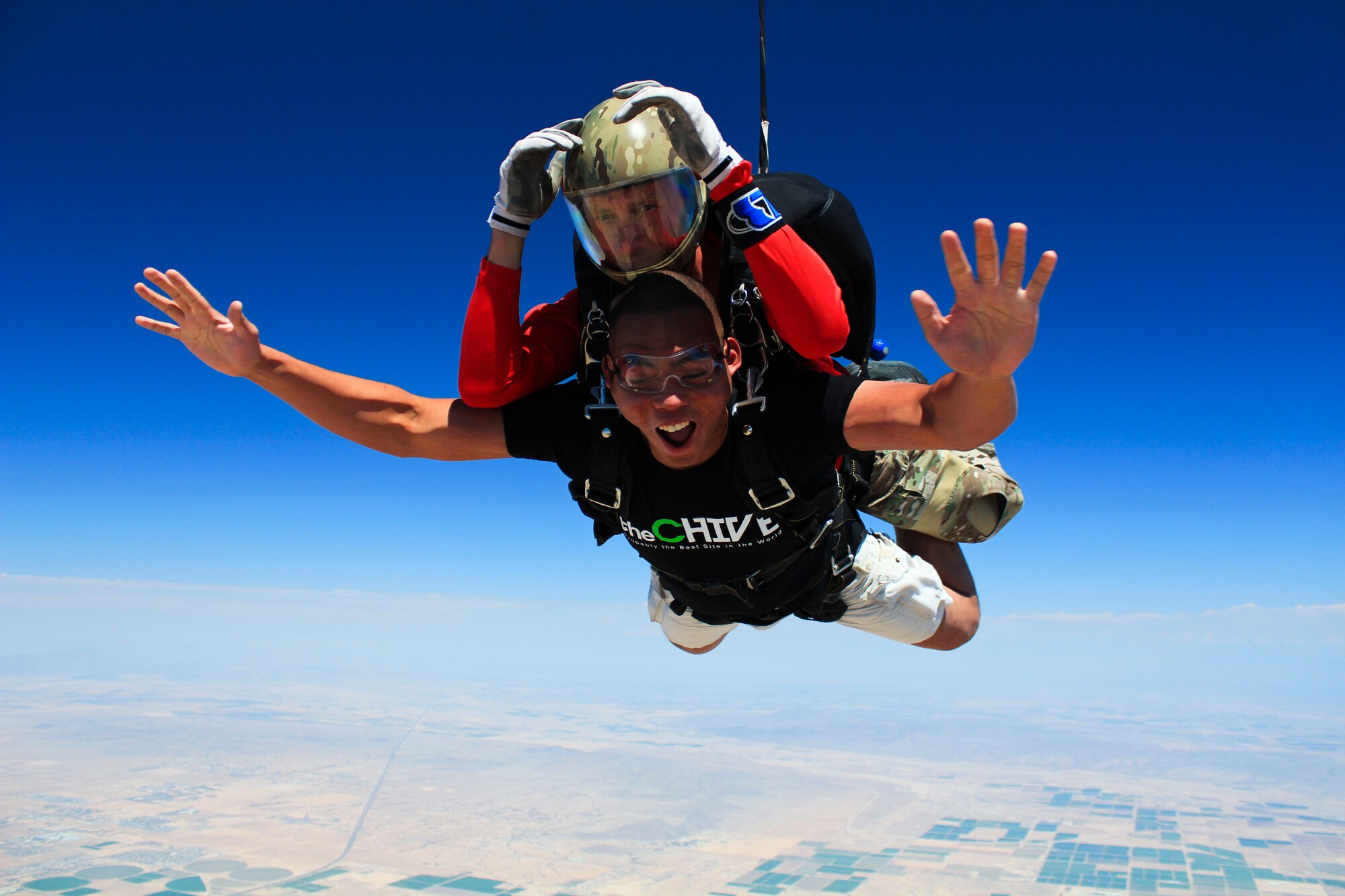 Airman 1st Class Brando Sompie, 56th Force Support Squadron, freefalls from 13,000 feet with a skydiving instructor Aug. 17 during a tandem skydiving event at Skydive Arizona in Eloy. The Airmen freefell for nearly a minute, reaching speeds of approximately 120 mph, or 200 feet per second, before opening the parachutes. The event was hosted by Outdoor Recreation’s Single Airman Program. (Courtesy photo)