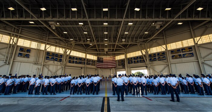 Airmen stand at parade rest in their respective squadron formations during the JB Charleston Change of Command ceremony, Aug. 29, 2013, at JB Charleston – Air Base. Col. Jeffrey DeVore, previously the commander of the 386th Expeditionary Operations Group, Southwest Asia, officially assumed command from Col. Richard McComb during the change of command ceremony. McComb will be assuming duties at the Pentagon, Washington D.C. As the JB Charleston commander, McComb provided installation support to a total force of more than 86,000 Airmen, Sailors, Soldiers, Marines, Coast Guardsmen, civilians, dependents and retirees across both the Air Base and Weapons Station. (U.S. Air Force photo/ Senior Airman Dennis Sloan)