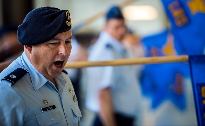 Lt. Col. James Hodges, 628th Security Forces Squadron commander, calls his flight to attention during the JB Charleston Change of Command ceremony, Aug. 29, 2013, at JB Charleston – Air Base. Col. Jeffrey DeVore, previously the commander of the 386th Expeditionary Operations Group, Southwest Asia, officially assumed command from Col. Richard McComb during the change of command ceremony. McComb will be assuming duties at the Pentagon, Washington D.C. As the JB Charleston commander, McComb provided installation support to a total force of more than 86,000 Airmen, Sailors, Soldiers, Marines, Coast Guardsmen, civilians, dependents and retirees across both the Air Base and Weapons Station. (U.S. Air Force photo/ Senior Airman Dennis Sloan)
