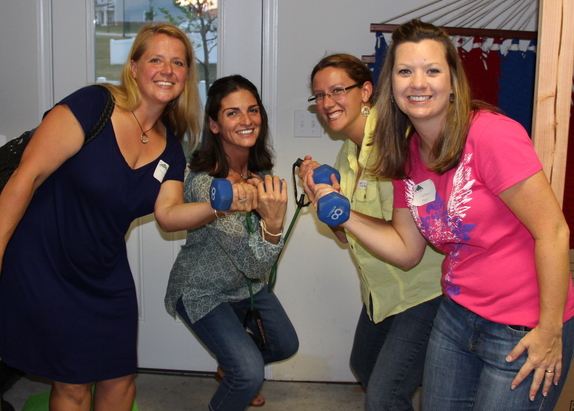 Members of the Whiteman Officer Spouses Club enjoy time together at the August Spouses Social at Whiteman Air Force Base, Mo., August 9, 2013. The purpose of the spouses club is to provide support for each other, through social events and activities while volunteering to support the base and local communities. (Courtesy Photo)