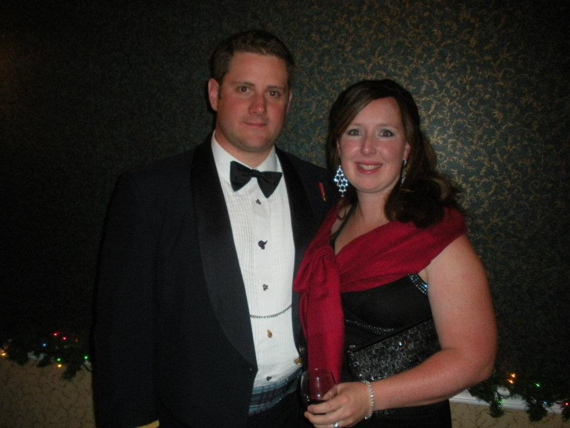 Royal Canadian Air Force Capt. Phil Desmarais, 533rd Training Squadron Student Operations flight chief, poses with his wife, Catherine, during a hoilday party in December 2012. The Desmarais' changed their lifestyle and have lost a combined total of 101 pounds. (Courtesy photo)