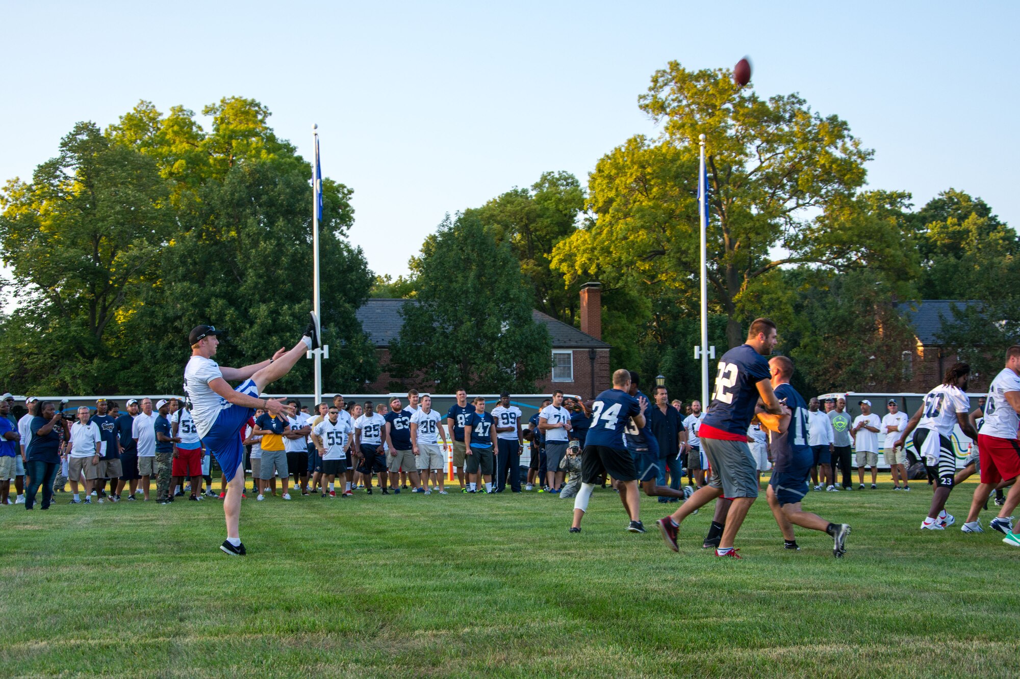 John Hekker punts the ball during a scrimage Aug. 28, 2013, Scott Air Force Base, Ill. Hekker and the rest of the St. Louis Rams visited the base and ran a number of plays against a team of Airmen stationed at Scott AFB. Hekker is the punter for the Rams. (U.S. Air Force photo/Staff Sgt. Jonathan Fowler)