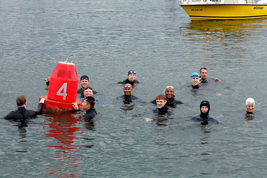 Participants of the Josh Fueston Memorial Swim to Live event tread water at the 4-mile buoy that marks the end of the relay, Aug. 25, 2013, in Bellingham, Wash. The relay was created by Laurie Fueston of Bellingham, in honor of her son who lost his battle with post-traumatic stress disorder. (U.S. Air Force photo/Capt. Rachel Ianacone)