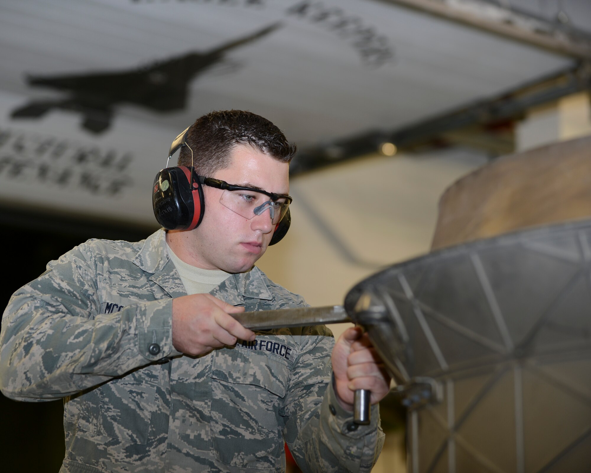 Airman 1st Class Brendan McCormick, 48th Equipment Maintenance Squadron aircraft structural maintenance apprentice, shoots a rivet into an engine augliner at Royal Air Force Lakenheath, England, Aug. 29, 2013. McCormick was nominated for a Liberty Spotlight because he displays the core value of “Excellence in All We Do.” (U.S. Air Force photo by Airman 1st Class Trevor T. McBride/Released) 