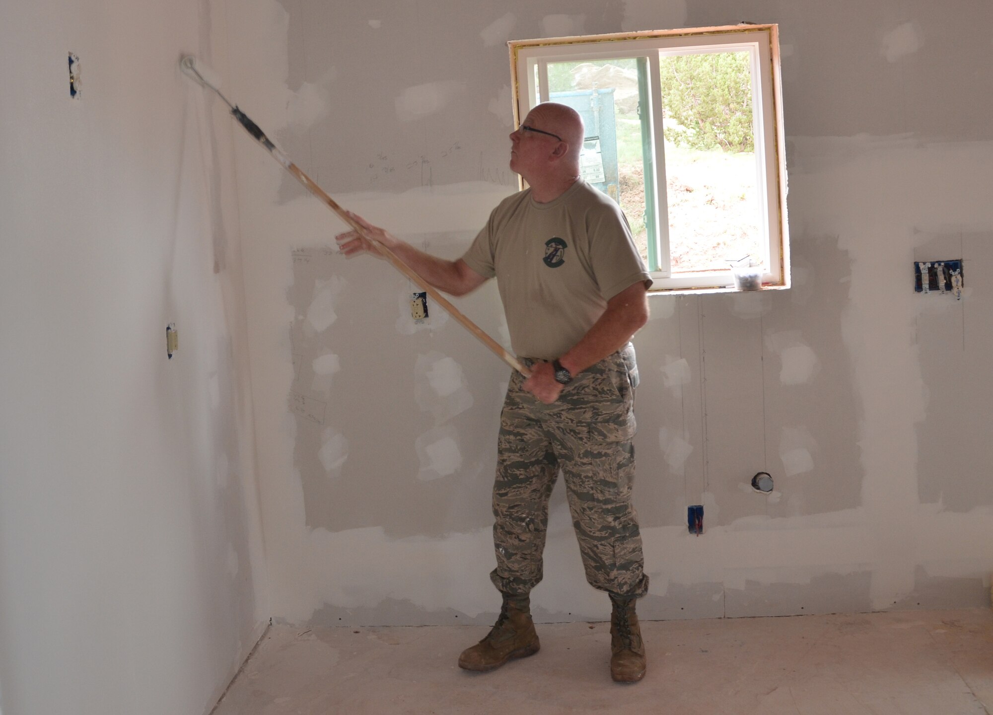 Missouri Air National Guard Chief Master Sgt. John Morrissey, 131st Civil Engineer Squadron superintendent, paints walls at St. Michaels Academy in Window Rock, Ariz., Aug. 8, 2013. The 131st CES crew members developed a sense of pride and joy in, and were appreciated for, their hard work, dedication and selflessness. (U.S. Air Force photo/Released)

