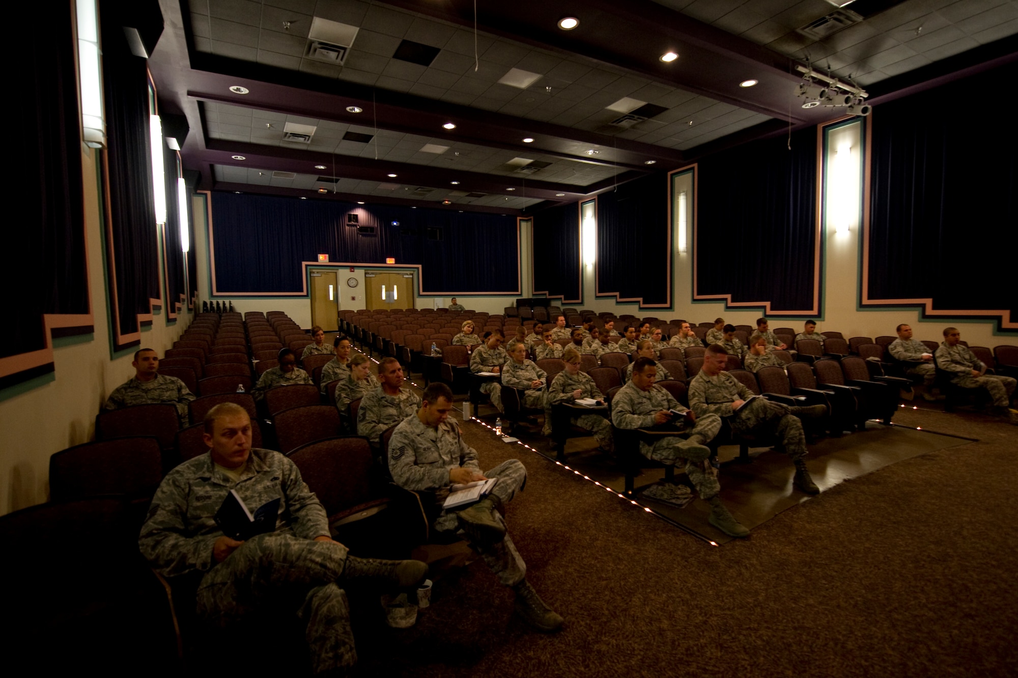 Airman from different units on base sit in the King Auditorium listening to Dr. John C. Maxwell's "Five Levels of Leadership" course. The Top-3 Professional Development Team offered  the course to Airmen of all ranks at Hurlburt Field.(U.S. Air Force Photo/Senior Airman  Naomi Griego)