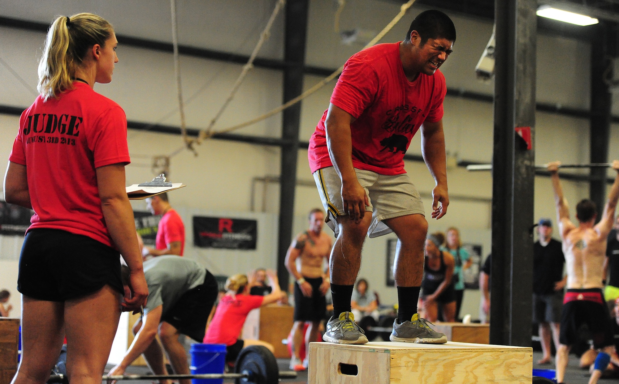 Gerald Cawelti, a U.S. Air Force Officer Training School prospect, performs box jumps during a competition at the Crossfit Believe gym in Warrensburg, Mo., Aug. 8, 2013. More than $2,530 was raised during the event in support of people all over the world who are receiving care for brachial plexus injuries. (U.S. Air Force photo by Staff Sgt. Nick Wilson/Released)