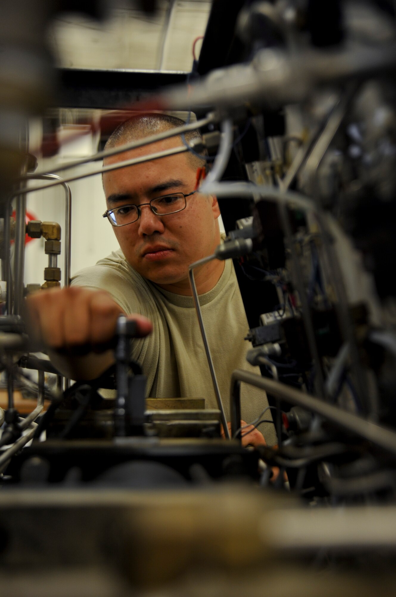Senior Airman Nicholas Durette, 22nd Maintenance Squadron aerospace ground equipment journeyman, tunes the limit switch on a booster for a self generating nitrogen servicing cart Aug. 29, 2013, at McConnell Air Force Base Kan. Aerospace ground equipment Airmen specialize in preventative maintenance, providing the Air Force with reliable and mission ready equipment. Durette was selected as the 22nd Air Refueling Wing spotlight performer for the week of Aug. 26 to 30 (U.S. Air Force photo/Airman 1st Class John Linzmeier)
