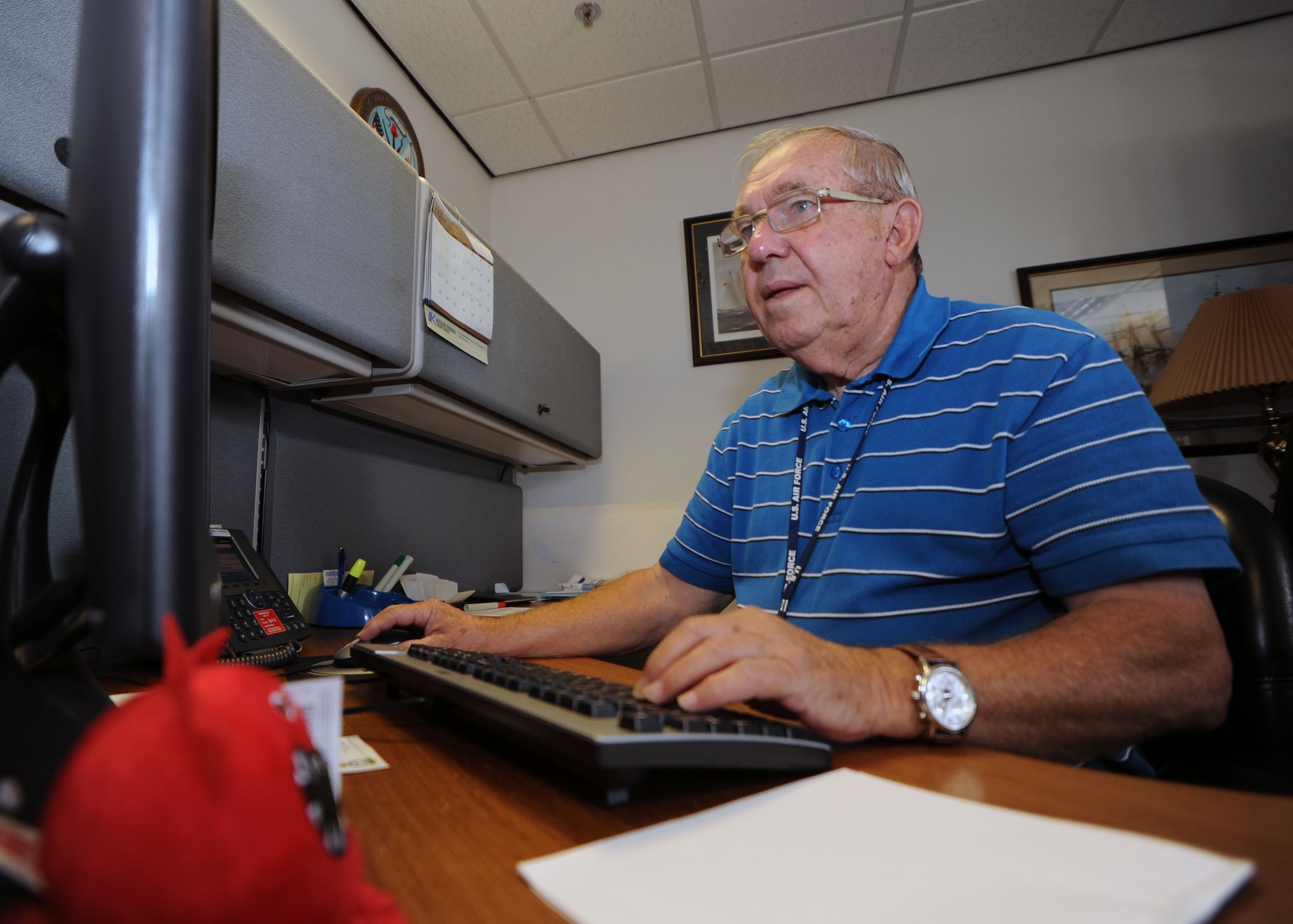 Dick Good, Joint RAF Mildenhall and RAF Lakenheath Retiree Activities Office volunteer co-director, returns emails and catches up on office work Aug. 29, 2013, in the RAO on RAF Mildenhall, England. The few volunteers who donate their time to the RAO, such as Good, alternate manning the office whenever they can to ensure the doors stay open as long as possible. The RAO serves as a focal point for the retired military community and the active duty force in the greater U.K. area. (U.S. Air Force photo by Airman 1st Class Preston Webb/Released)