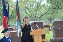 Yvonne Campos sang the Battle Hymn of the Republic during the annual annual wreath laying ceremony in Stonewall, Texas, to honor former U.S. President Lyndon B. Johnson.   (U.S.Air Force photo by Rich McFadden/released)