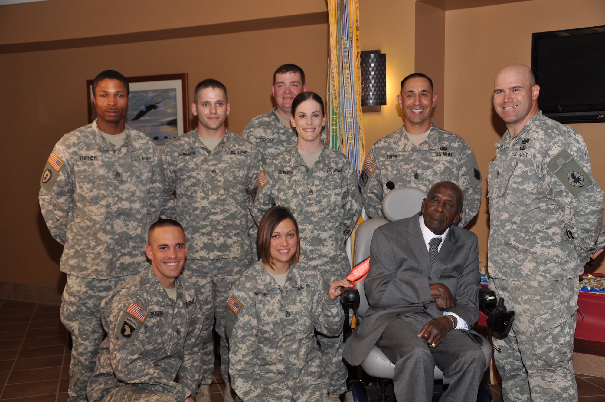 BIG SPRING, Texas- Otho Henry, World War II Army veteran, poses for a photo with members from the Army 344th Military Battalion, during the celebration of his 100th birthday at the West Texas Veterans’ Affairs Health Care System Facility Aug. 23. Henry entered the service at the age of 28 and left the service with the rank of corporal. (U.S. Air Force photo/ Airman 1st Class Erica Rodriguez)