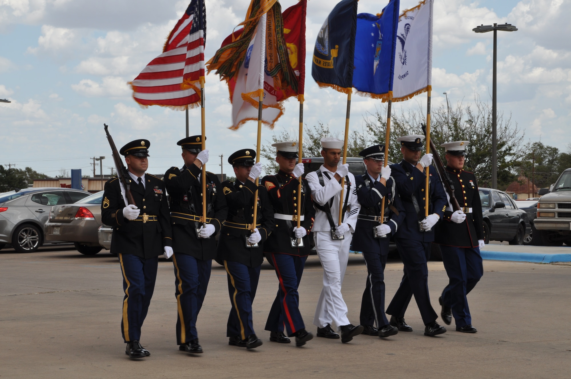 Members from the Team Goodfellow Color Guard present the colors during the celebration of Otho Henry’s 100th birthday at the West Texas Veterans’ Affairs Health Care System Aug. 23. Henry, World War II Army veteran, was visited by Air Force and Army members from Team Goodfellow who presented him with mementos and thanked him for his service to the country. (U.S. Air Force photo/ Airman 1st Class Erica Rodriguez)