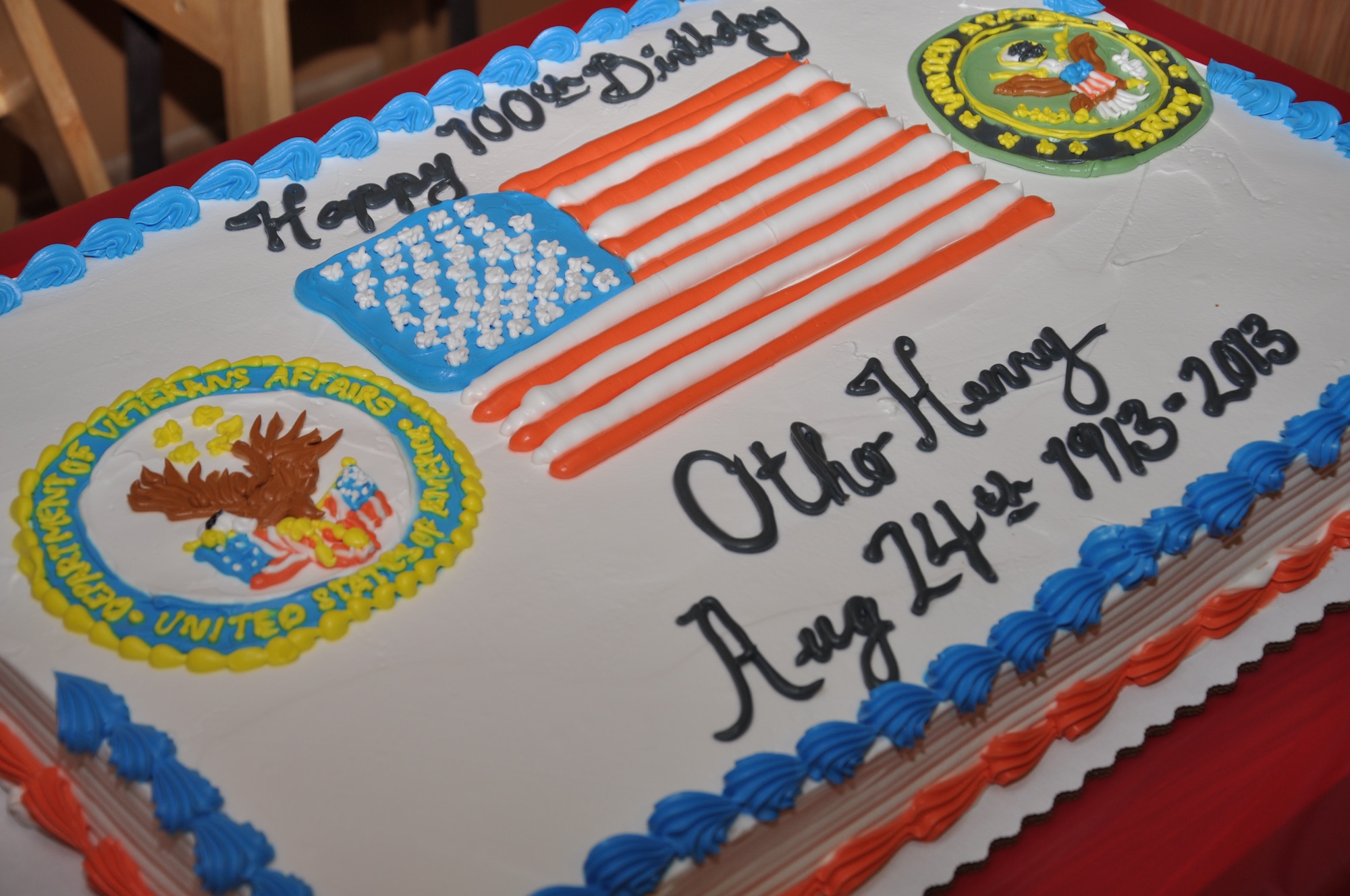 BIG SPRING, Texas- A cake is presented to Otho Henry, World War II Army veteran, for his 100th birthday at the West Texas Veterans’ Affairs Health Care System Aug. 23. Henry is currently the oldest veteran in care at the West Texas Veterans’ Affairs Health Care System Facility. (U.S. Air Force photo/ Airman 1st Class Erica Rodriguez)
