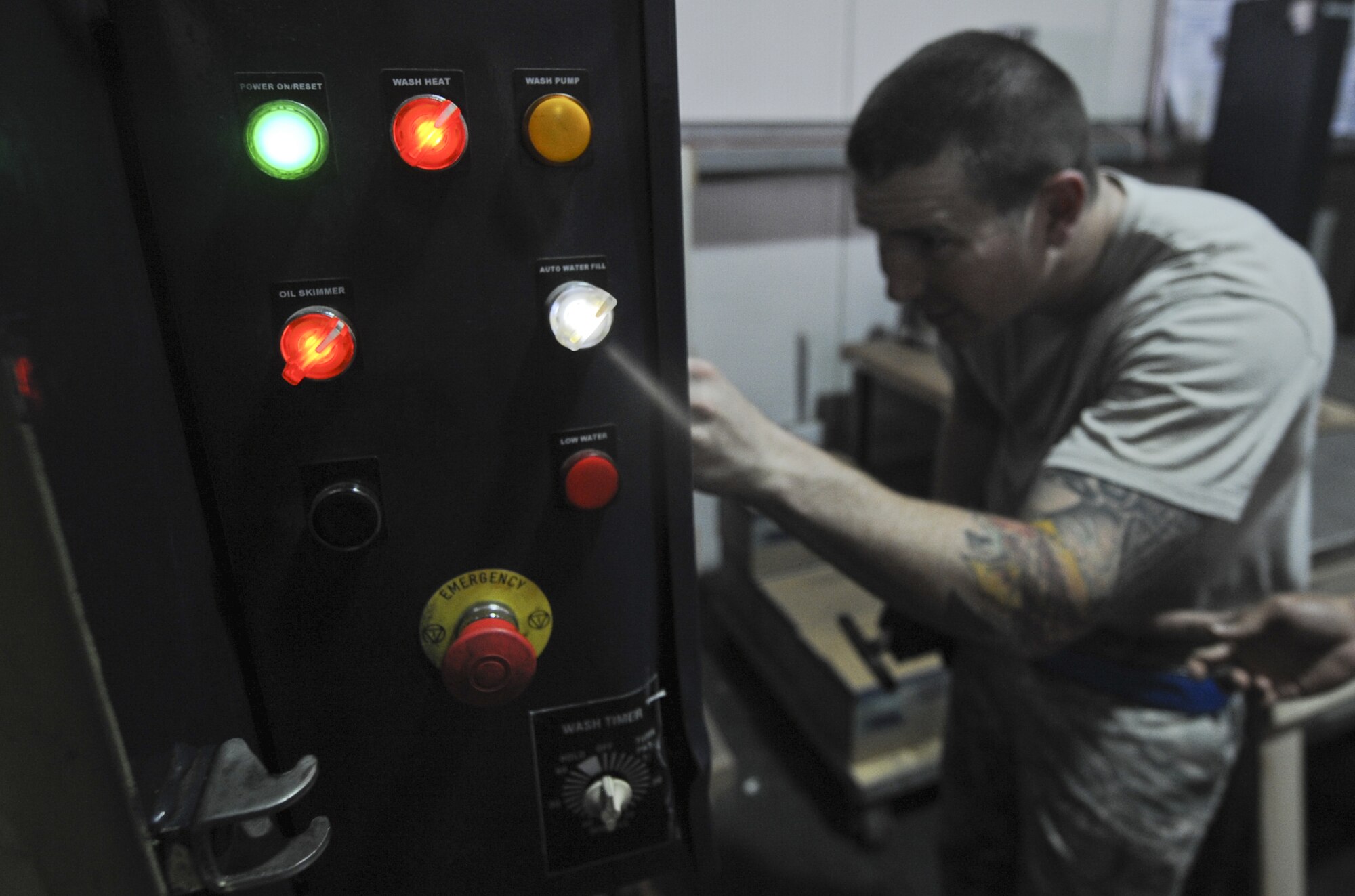 U.S. Air Force Staff Sgt. Ryan McGee, 380th Expeditionary Maintenance Squadron Crash Recovery craftsman, checks a machine designed to clean aircraft wheels at an undisclosed location in Southwest Asia Aug. 26, 2013. The machine sprays extremely hot fluid on the wheel to remove grease so the wheels can be inspected for cracks. McGee calls Birmingham, Ala., home and is deployed from Mountain Home Air Force Base, Idaho. (U.S. Air Force photo by Staff Sgt. Jacob Morgan)