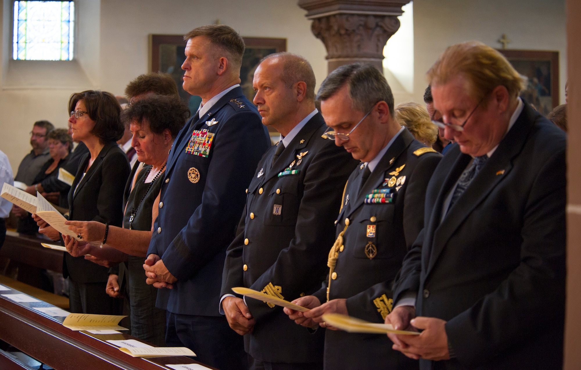 RAMSTEIN, Germany -- From left, Minister President of Rheinland-Pfalz Malu Dryer; Regine Layes, wife of the Ramstein-Miesenbach mayor; General Frank Gorenc, U.S. Air Forces in Europe and Air Forces Africa commander, Lt. Gen. Gabriele Salvestroni, Italian air force vice commander; Brig. Gen. Alberto Biavati, Italian defense attaché; and Kevin Milas, Frankfurt Consul General, attend a memorial service in the St. Nikolas Church for the 70 people who died in the 1988 Ramstein air show disaster, Aug. 28, 2013. The service marked the 25th anniversary of the disaster. (U.S. Air Force photo/Tech. Sgt. Benjamin Wilson)