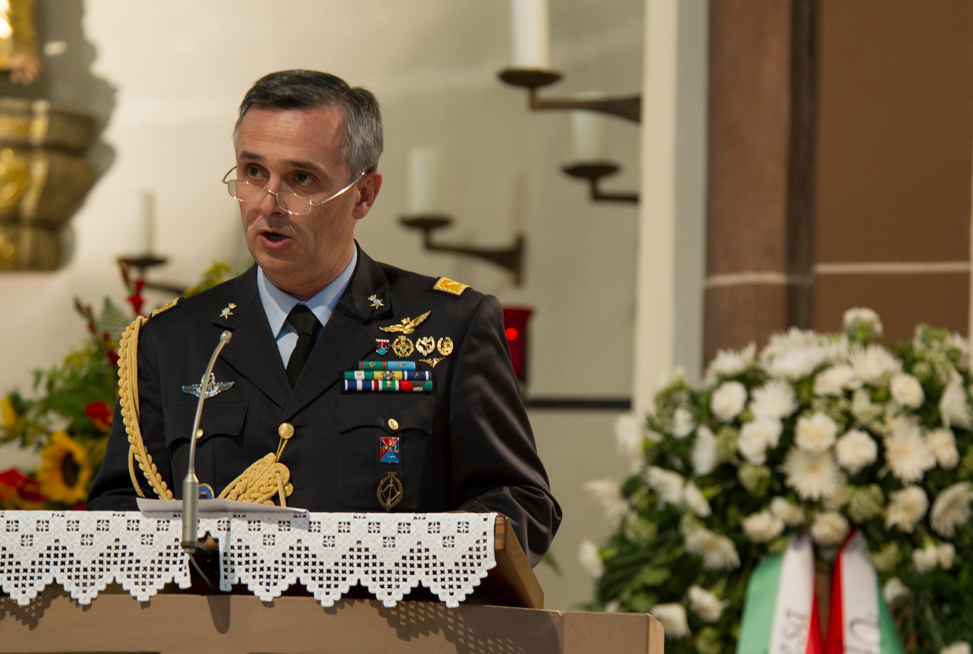 RAMSTEIN, Germany -- Italian Brig. Gen. Alberto Biavati, Italian defense attaché delivers a speech on behalf of the Italian air force at a memorial service in the St. Nikolas Church for the 1988 Ramstein air show disaster, Aug. 28, 2013. The service marked the 25th anniversary of the disaster, in which an Italian aerial demonstration team crashed, killing 70 people. (U.S. Air Force photo/Tech. Sgt. Benjamin Wilson)