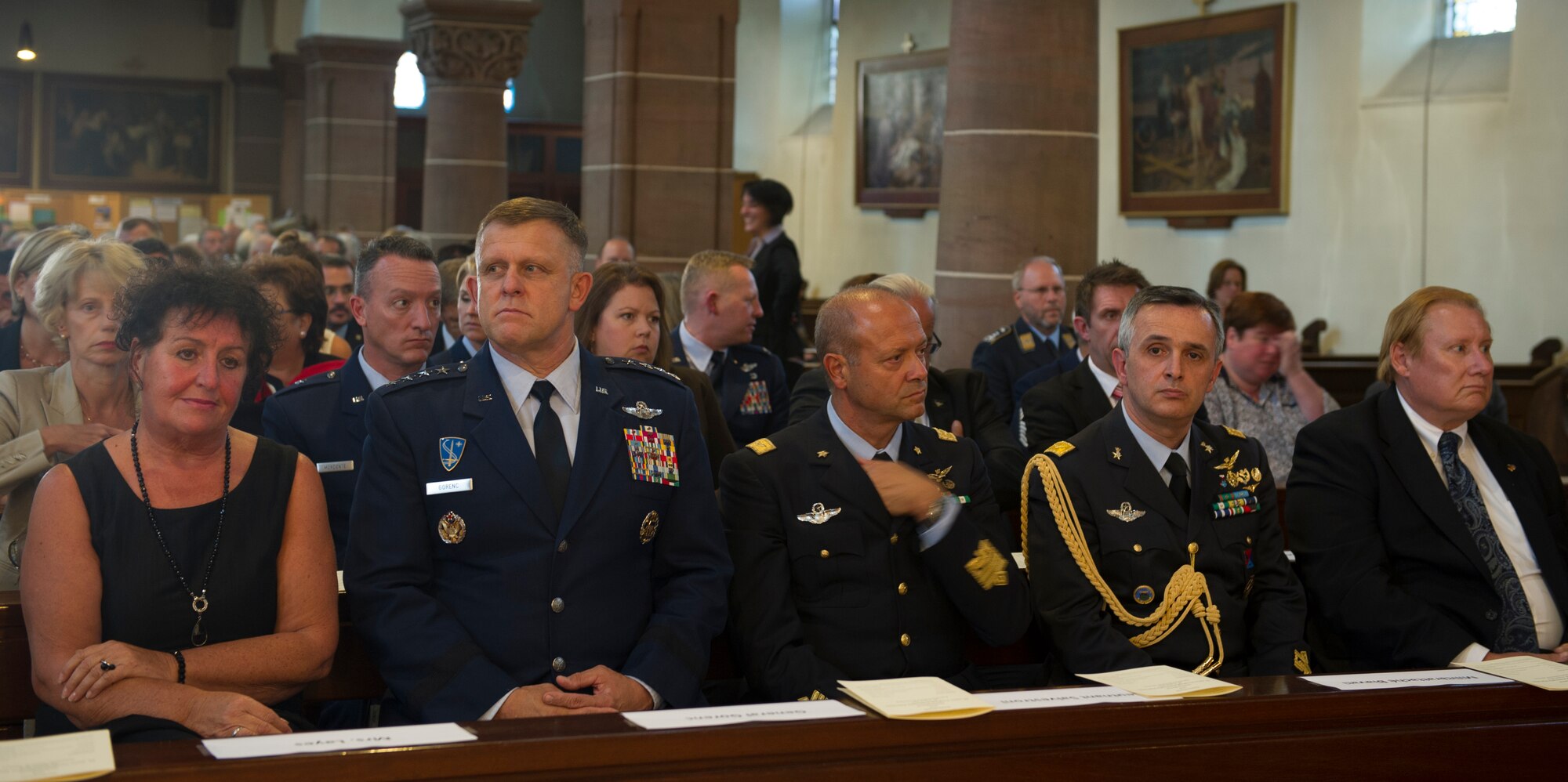 RAMSTEIN, Germany -- From left, Regine Layes, wife of the Ramstein-Miesenbach mayor; General Frank Gorenc, U.S. Air Forces in Europe and Air Forces Africa commander, Lt. Gen. Gabriele Salvestroni, Italian air force vice commander; Brig. Gen. Alberto Biavati, Italian defense attaché; and Kevin Milas, Frankfurt Consul General, attend a memorial service in the St. Nikolas Church for the 70 people who died in the 1988 Ramstein air show disaster, Aug. 28, 2013. The service marked the 25th anniversary of the disaster. (U.S. Air Force photo/Tech. Sgt. Benjamin Wilson)
