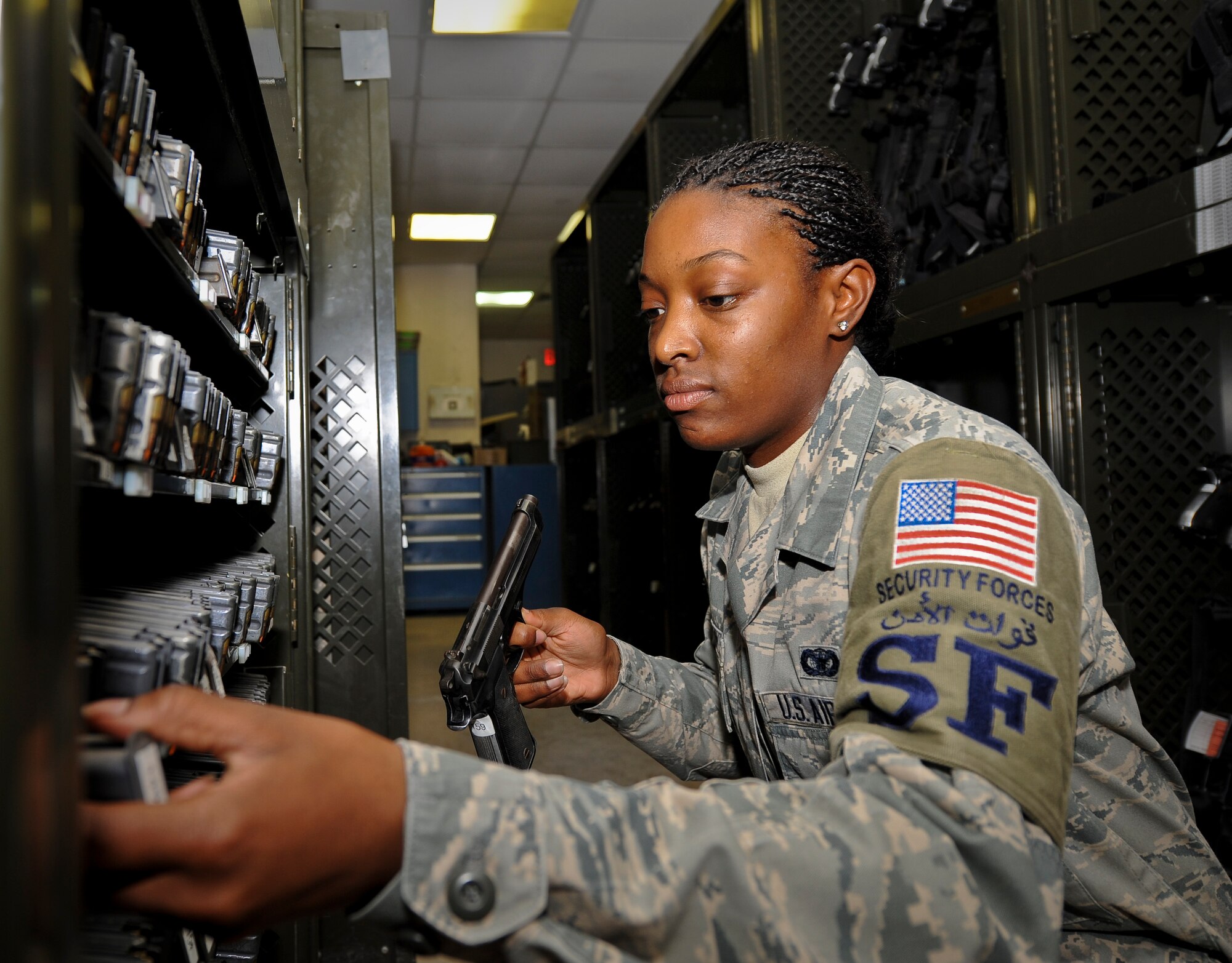 Senior Airman Jamela Nuriddin inventories ammunition and weapons at the 379th Air Expeditionary Wing in Southwest Asia, Aug. 14, 2013. Nuriddin is a 379th Expeditionary Security Forces Squadron staff armorer deployed from Seymour Johnson Air Force Base, N.C., and a Raleigh, N.C., native. (U.S. Air Force photo/Senior Airman Benjamin Stratton)