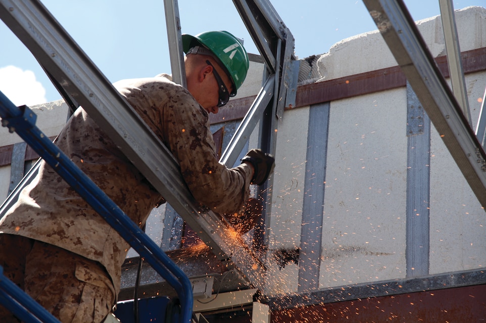 Lance Cpl. Jesse R. Gribble slices through a piece of metal Aug. 9 while deconstructing a dilapidated building on Camp Hansen. The building, along with another, presented a hazard to both personnel, as well as the equipment being stored in them due to deterioration from severe weather. Gribble is a combat engineer with 9th Engineer Support Battalion, 3rd Marine Logistics Group, III Marine Expeditionary Force.
