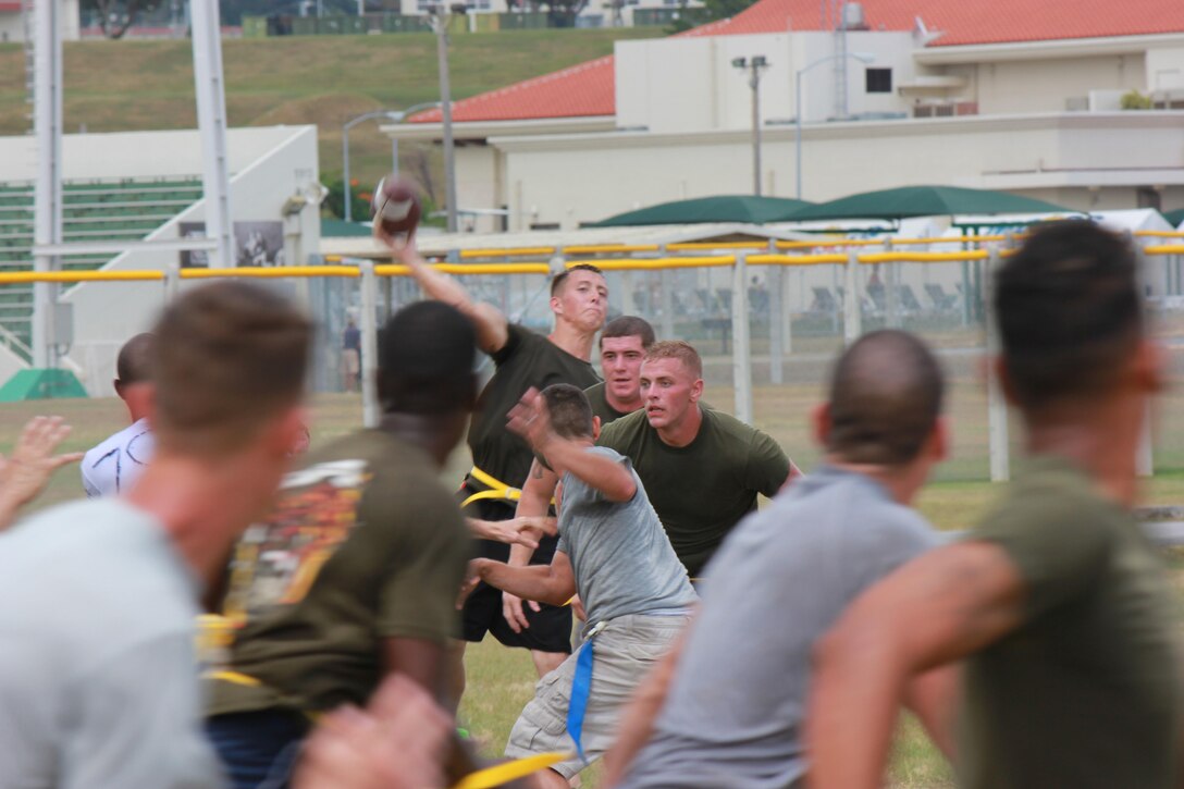 Marines with Marine Wing Support Squadron 172 participate in a flag-football game Aug. 16 as part of the 2nd annual Firebird Festival at the field behind on Camp Foster. “The flag football games were intense,” said Staff Sgt. Talan J. Wyenandt. “Though it was a flag football game the teams came out and gave their all. They weren’t afraid to get a little (aggressive) if they had to.” Wyenandt is the operations chief for MWSS-172, Marine Aircraft Group 36, 1st Marine Aircraft Wing, III Marine Expeditionary Force. 
