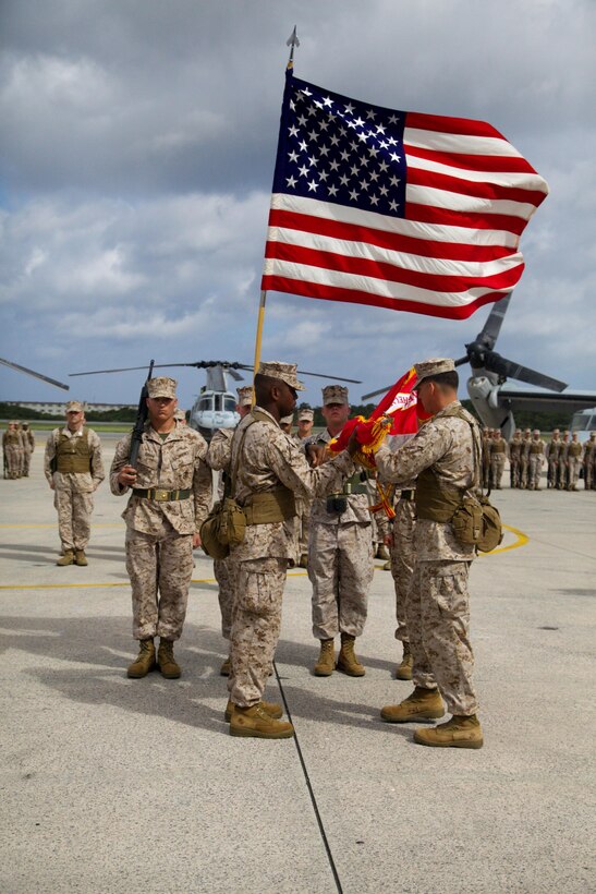 Lt. Col. Larry G. Brown, right, and Sgt. Maj. Devon A. Lee  prepare to case the unit colors Aug. 30 during the Marine Medium Tiltrotor Squadron 262 redesignation ceremony at Marine Corps Air Station Futenma. The squadron, previously Marine Medium Helicopter Squadron 262, was redesignated to reflect the replacement of the squadron's CH-46E Sea Knight helicopters with MV-22B Osprey tiltrotor aircraft.  The Osprey will increase the operational range, agility and load-carrying capabilities of VMM-262, providing III Marine Expeditionary Force with improved rapid-response ability throughout the Asia-Pacific region. VMM-262 is a part of Marine Aircraft Group 36, 1st Marine Aircraft Wing, III MEF.  Brown is the commanding officer, and Lee is the squadron sergeant major of VMM-262.