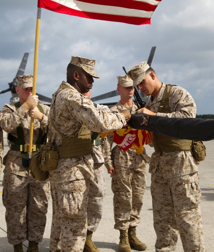 Lt. Col. Larry G. Brown, right, and Sgt. Maj. Devon A. Lee case the former unit colors Aug. 30 during the Marine Medium Tiltrotor Squadron 262 redesignation ceremony at Marine Corps Air Station Futenma. The squadron, previously Marine Medium Helicopter Squadron 262, was redesignated to reflect the replacement of the squadron's CH-46E Sea Knight helicopters with MV-22B Osprey tiltrotor aircraft.  The Osprey will increase the operational range, agility and load-carrying capabilities of VMM-262, providing III Marine Expeditionary Force with improved rapid-response ability throughout the Asia-Pacific region. VMM-262 is a part of Marine Aircraft Group 36, 1st Marine Aircraft Wing, III MEF.  Brown is the commanding officer, and Lee is the squadron sergeant major of VMM-262. 