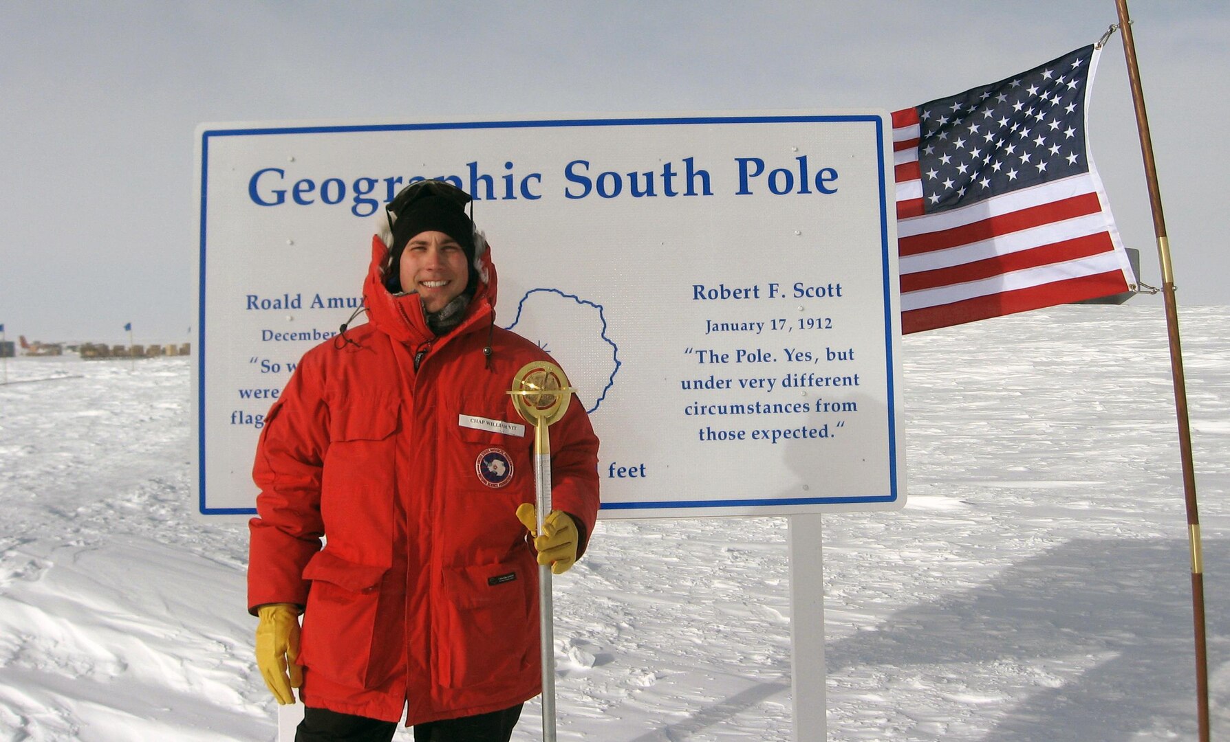 Chaplain Capt. William Vit of Sioux City, Iowa, stands at the geographic South Pole. His Antarctic deployment is coming to end.