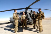 From left, Capt. Shaun Cullen, Capt. Tripp Zanetis, Tech. Sgt. Jim Denniston and Tech. Sgt. Erick Pound are all members of the 101st Rescue Squadron, New York Air National Guard, currently assigned to the 26th Expeditionary Rescue Squadron, take turns teasing each other.