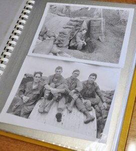 Black-and-white photos serve as reminders of Lt. Col. David Butler's service in Vietnam.