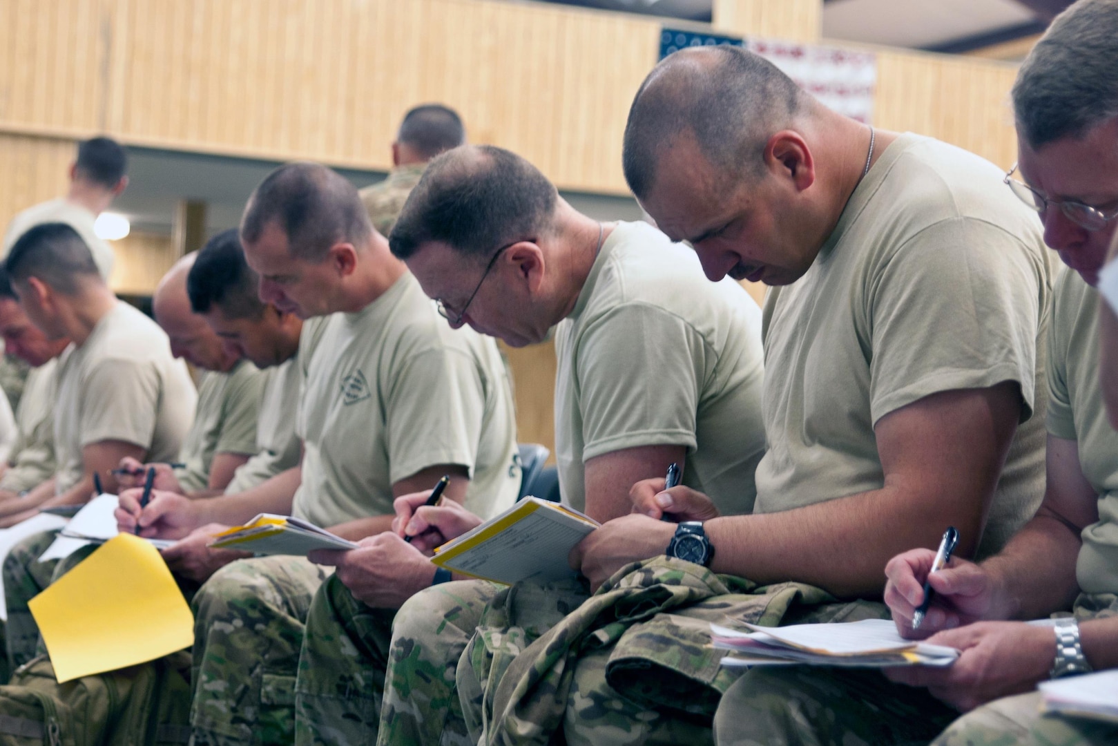 Soldiers of 27th Stability Transition Team, 174th New York National Guard STT, complete medical evaluation forms during their demobilization as Camp Shelby Joint Force Training Center, Dec. 4, 2012. The 174th Soldiers are returning from a deployment to the Middle East.