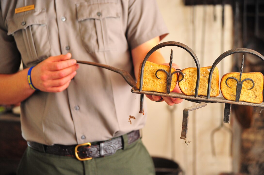 Phillip Greenwalt, park ranger, explains an 18th-century toaster in a kitchen at George Washington’s Birthplace National Monument in Colonial Beach, Va. on Aug. 28, 2013. The monument also has a working blacksmith shop, weaving shop and house from the same time period.  