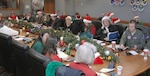 Volunteers answer phone calls Dec. 24, 2011, at the NORAD Tracks Santa Operations Center on Peterson Air Force Base.