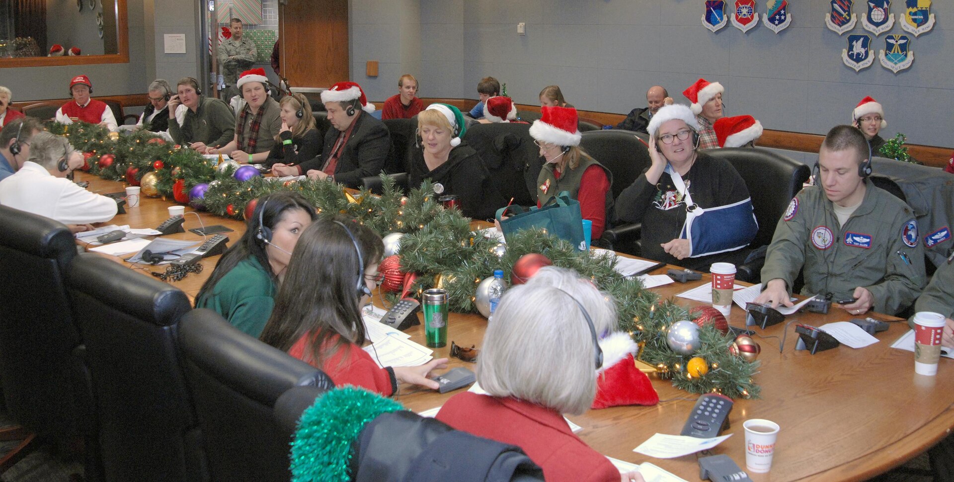 Volunteers answer phone calls Dec. 24, 2011, at the NORAD Tracks Santa Operations Center on Peterson Air Force Base.
