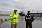 Port of Wilmington security manager Jerry Custis discusses security measures at the port with Col. Rodney Smart, chair of the Trinidad and Tobago Energy Sector Security Initiative.