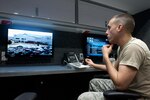 Kentucky Air National Guard Senior Airman Eric Finley, an emergency manager for the 123rd Civil Engineer Squadron, operates a surveillance camera in the unit's new Mobile Emergency Operations Center in Louisville on Dec. 1, 2012.