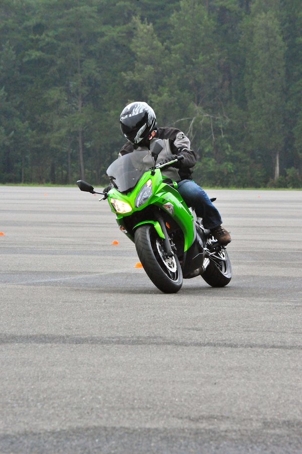 Staff Sgt. Gabriel Brennan maneuvers a curve on his motorcycle during an Advanced Cornering Clinic at Camp Upshur aboard Marine Corps Base Quantico on Aug. 29, 2013. The class covered topics such as enhanced speed, cornering judgments, breaking techniques and body posture.