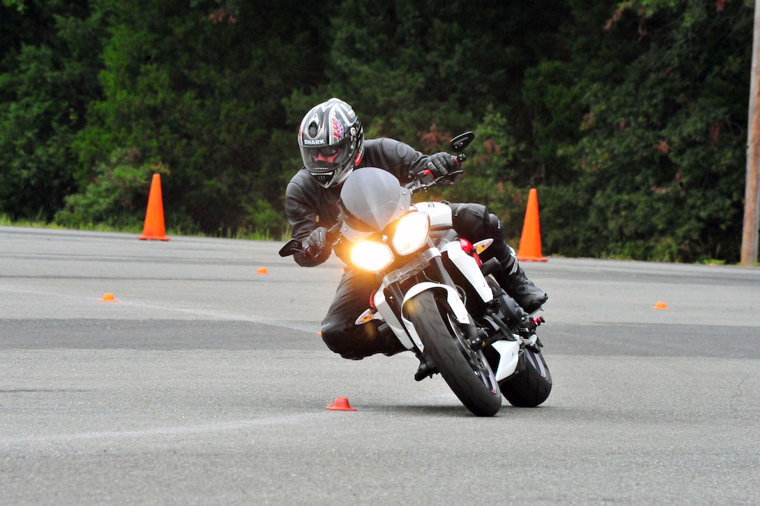 John Kousaie, Woodbridge resident, maneuvers a curve on his motorcycle during an Advanced Cornering Clinic at Camp Upshur aboard Marine Corps Base Quantico on Aug. 29, 2013. The course is an advanced course for students who have completed both Basic Riders Courses.
