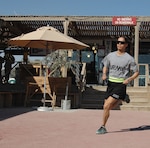 Former National Guard Bureau marathon champion Capt. Varinka Barbini Ensminger works out on the venerable Boardwalk running track at Kandahar Airfield, Afghanistan. Ensminger's deployment with the Kandahar Agri-business Development Team concluded in late December.