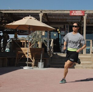 Former National Guard Bureau marathon champion Capt. Varinka Barbini Ensminger works out on the venerable Boardwalk running track at Kandahar Airfield, Afghanistan. Ensminger's deployment with the Kandahar Agri-business Development Team concluded in late December.