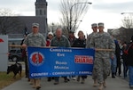 New York Army National Guard Soldiers, families, friends and supporters from the community march in the the 9th annual Christmas Eve road march in Glens Falls, N.Y., Dec. 24, 2012.