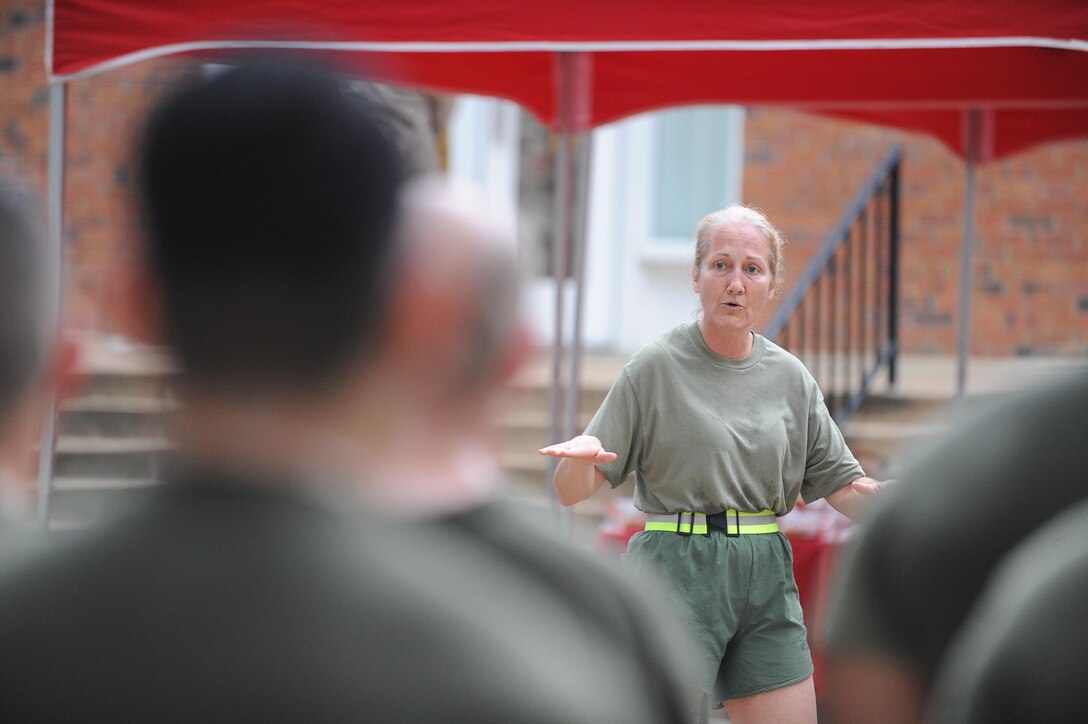 Col. Robin Gallant, Headquarters and Service Battalion, commanding officer, talks to the Marines after the battalion run aboard Marine Corps Base Quantico on Aug 29, 2013. The run was led by Gallant as a way to motivate the Marines and pass a safety brief. 