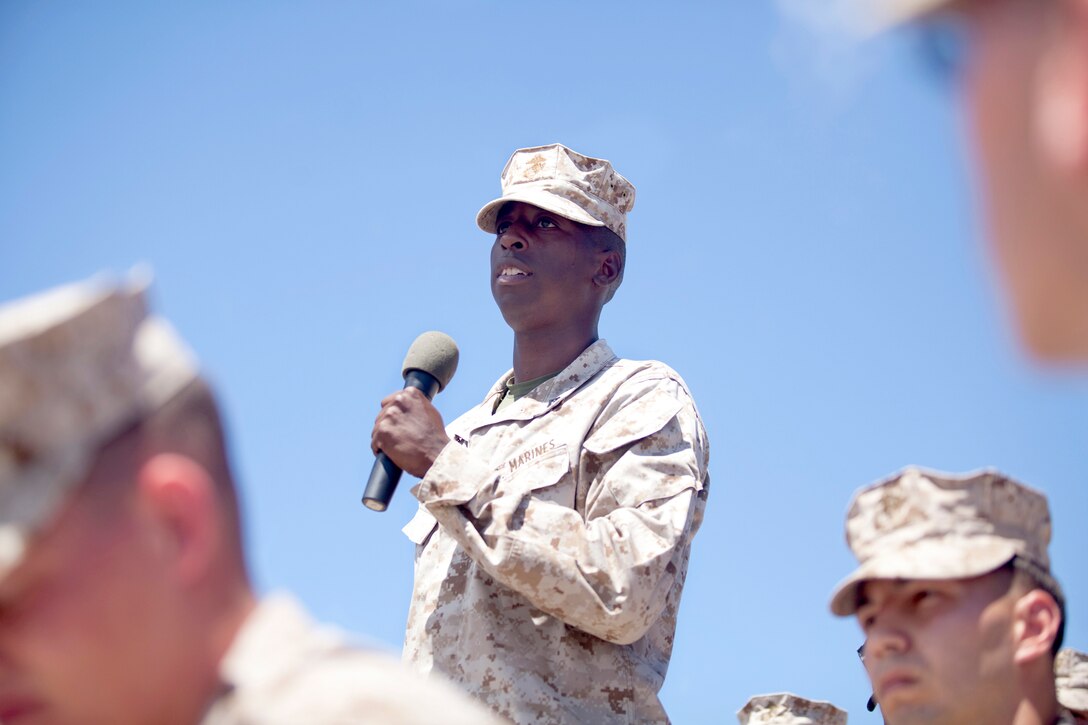 Lance Cpl. Mario Stacy, a meteorology and oceanography forecaster with Marine Corps Air Station Kaneohe Bay, asks the honorable Chuck Hagel, U.S. Secretary of Defense, a question during his visit to Hangar 102 at MCAS Kaneohe Bay, Aug. 22, 2013. (U.S. Marine Corps photo by Lance Cpl. Janelle Y. Chapman)