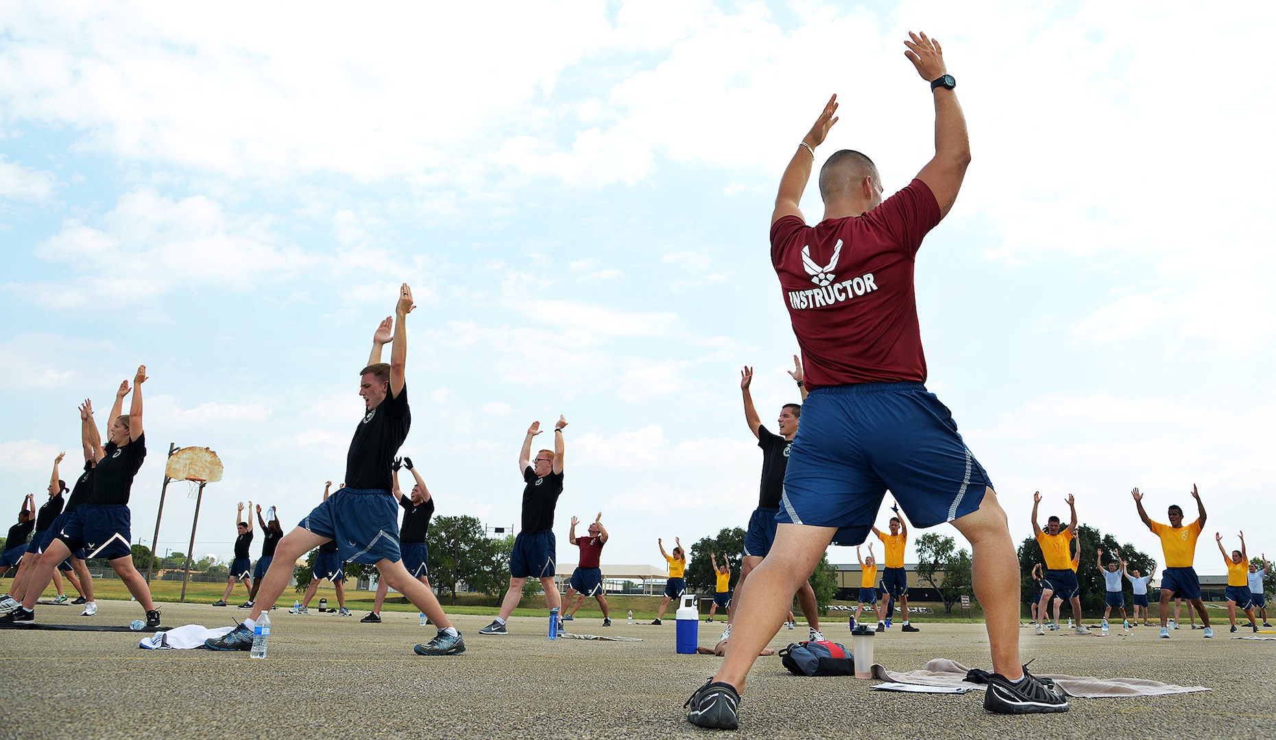 Staff Sgt. Thomas McKerlie, 802nd Force Support Squadron Blackhawk flight instructor, leads the Airman Leadership School in the weekly warrior workout August 19, at Joint Base San Antonio-Lackland. (U.S. Air Force photo by Benjamin Faske/released)