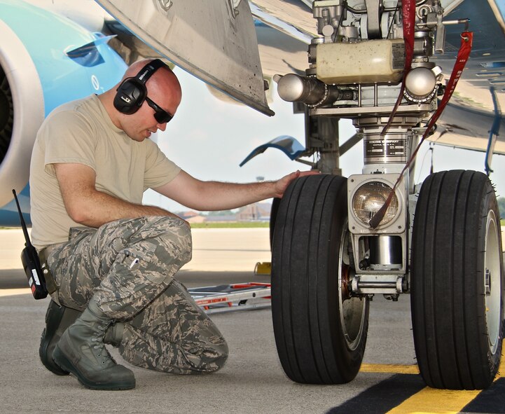 Senior Airman Jeremy Schrock, an aerospace maintenance journeyman for the 932nd Airlift Wing Maintenance Squadron, inspects a C-40C's landing gear after it returned from a mission.  Assigned to the 932nd Airlift Wing the C-40C provides safe, comfortable and reliable transportation for dignitaries and other U.S. leaders. (U.S. Air Force photo/Staff Sgt. Meiko Schill) 