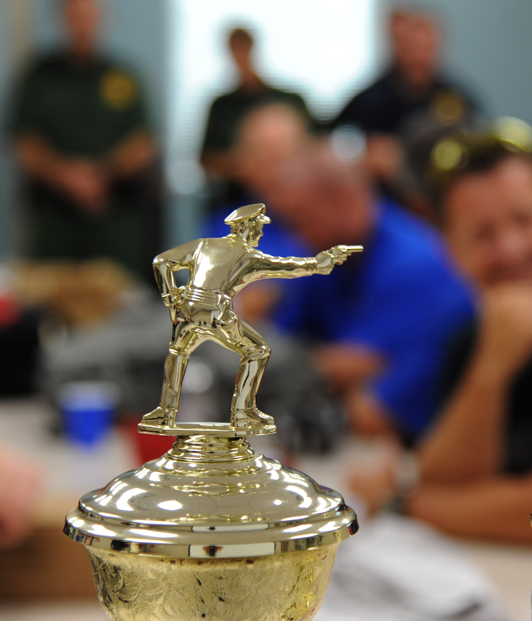 A trophy was awarded to the Gulfport Police Department five-man team for placing first in the second annual Air Force Office of Special Investigations and 81st Security Forces Squadron’s pistol shoot-off competition Aug. 30, 2013, at the indoor firing range, Keesler Air Force Base, Miss.  Nine teams from local law enforcement agencies competed in the event.  (U.S. Air Force photo by Kemberly Groue)