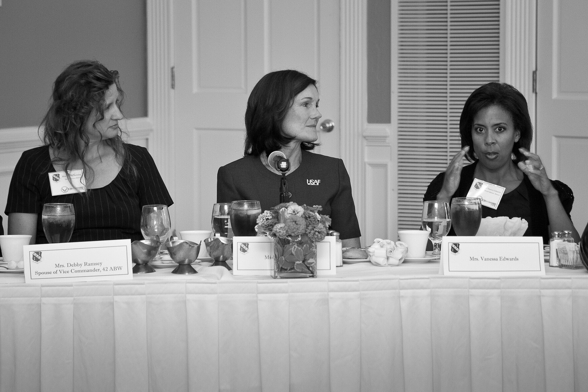 Vanessa Edwards, right, wife of Col. Trent Edwards, 42nd Air Base Wing commander, discusses the future of the Key Spouse Program during a luncheon with Debby Ramsey, left, wife of Col. Mark Ramsey, 42nd ABW vice commander, and Betty Welsh, center, wife of Gen. Mark Welsh, Air Force chief of staff, along with other commanders, first sergeants, key spouse mentors, key spouses and representatives from the Airman and Family Readiness Center.(U.S. Air Force photo by Donna L. Burnett)
