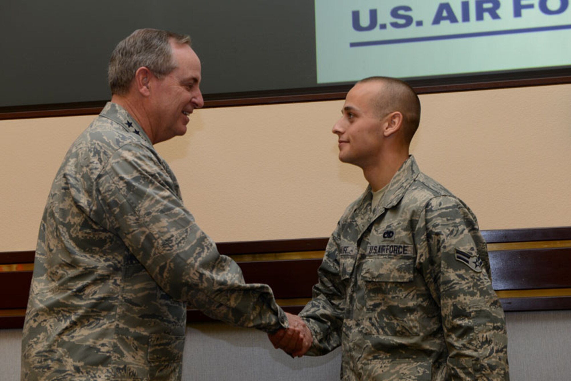Air Force Chief of Staff, Gen. Mark A. Welsh III recognizes Airman 1st Class Robert Ruff, assistant dedicated crew chief, 3rd Aircraft Maintenance Squadron, as an outstanding performer on Joint Base Elmendorf-Richardson Aug. 29. (U.S. Air Force photo/ Airman 1st Class Omari Bernard) 