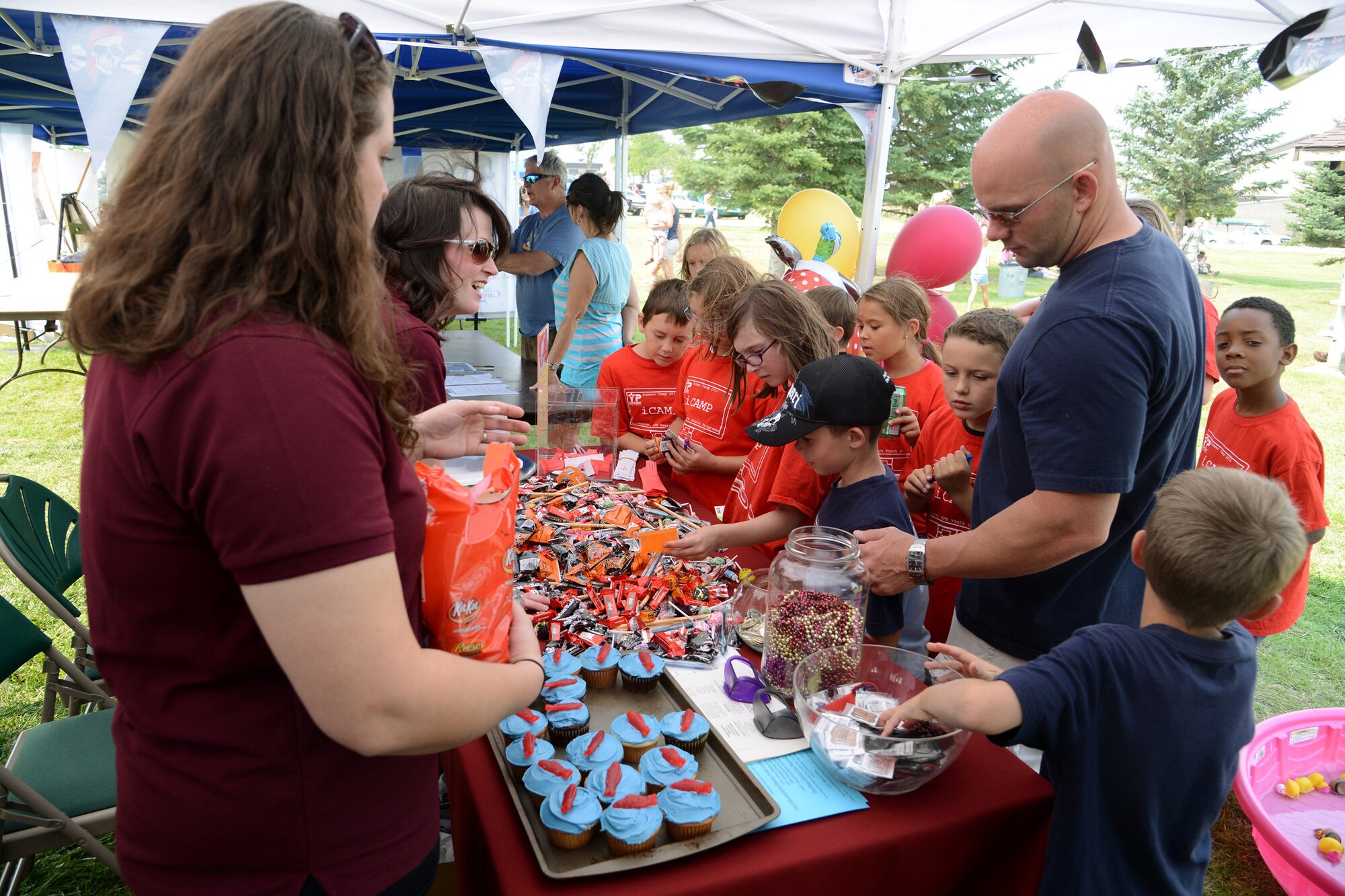 Wing One members gather around the Park University vendor table at the annual Malmstrom Air Force Base picnic Aug. 23 at Sun Plaza Park. The university was one of several vendors at the event. (U.S. Air Force photo/Staff Sgt. R.J. Biermann) 