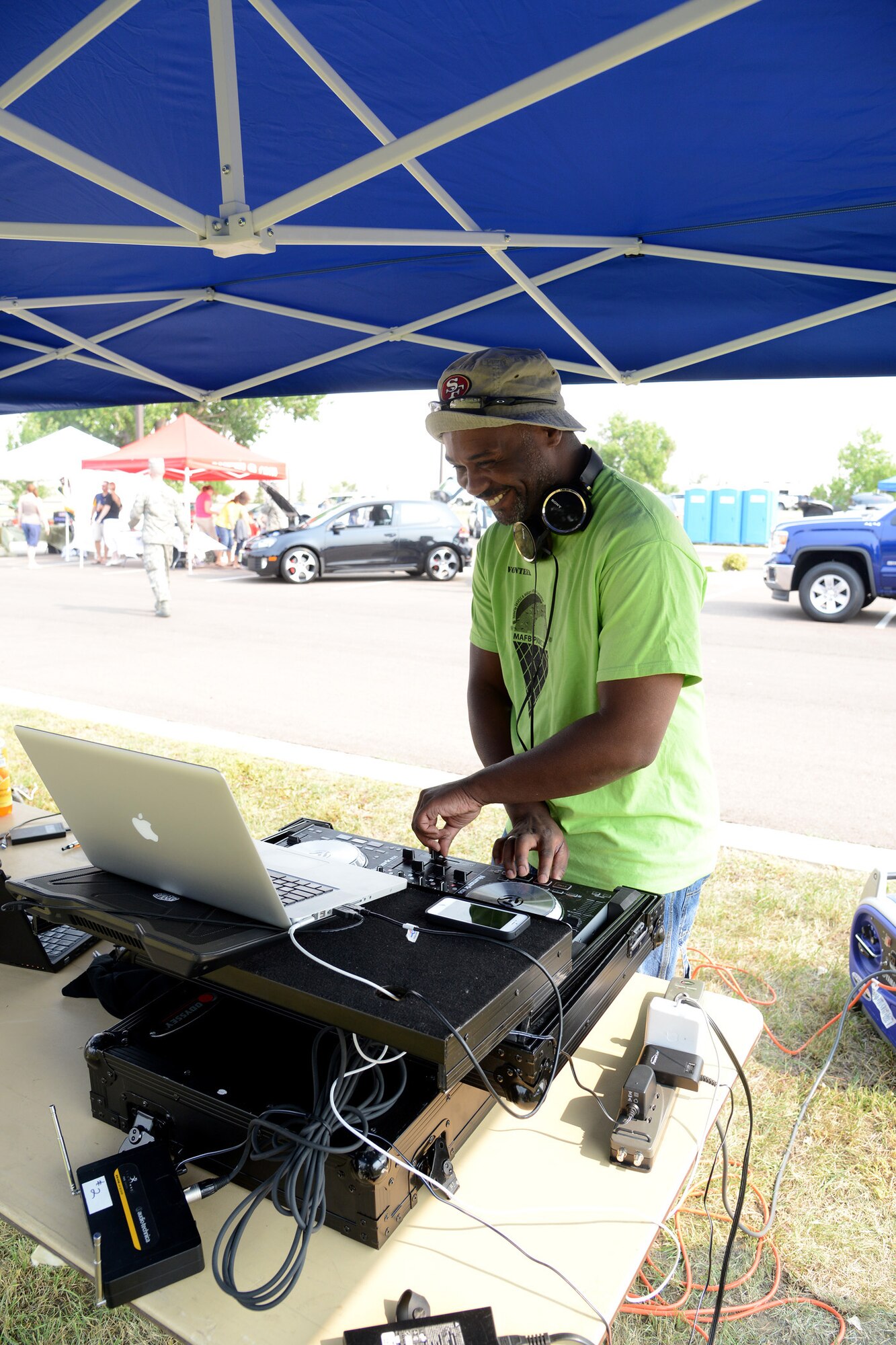 David Wilson-Scott, 341st Force Support Squadron Education Center member, disc jockeys at the annual Malmstrom Air Force Base picnic Aug. 23 at Sun Plaza Park. Wilson-Scott teamed with Staff Sgt. Stephen Marvin (not pictured), 819th RED HORSE Squadron unit deployment manager, to DJ the event. (U.S. Air Force photo/Staff Sgt. R.J. Biermann) 
