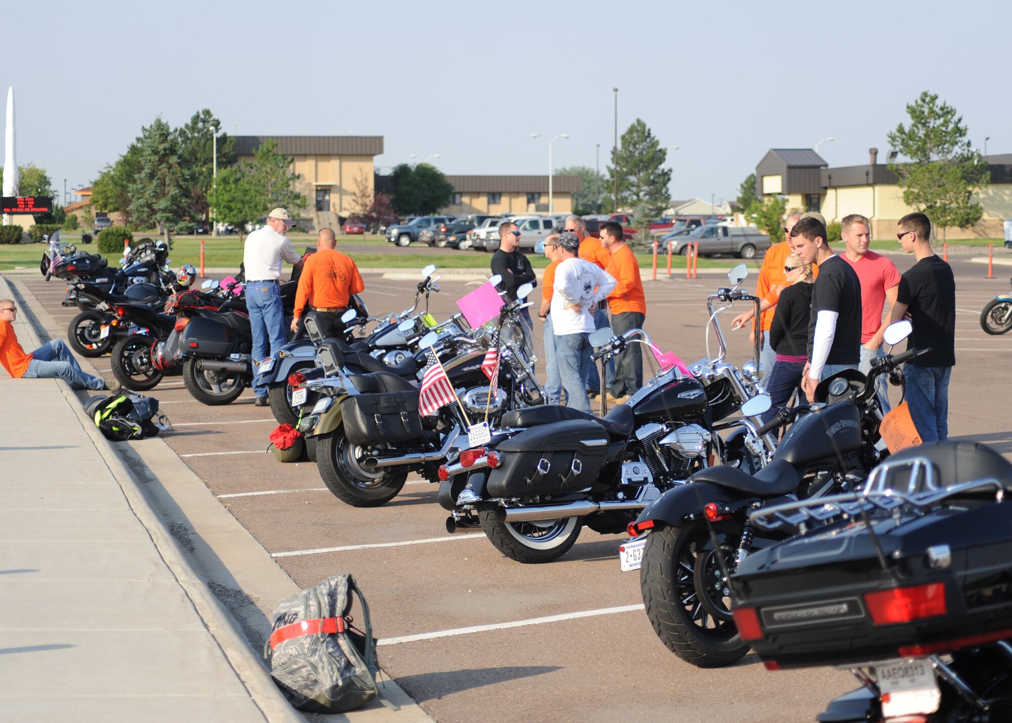Airmen line up their motorcycles and talk about the bikes' qualities during Rolling Thunder's bike show portion.  Nearly 40 motorcycles were entered into the show and were eligible to win in various categories, including Best Overall, People’s Choice and Most Potential.  (U.S. Air Force photo/Senior Airman Cortney Paxton)